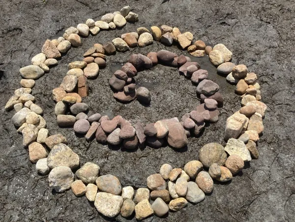 A spiral of rocks on the ground