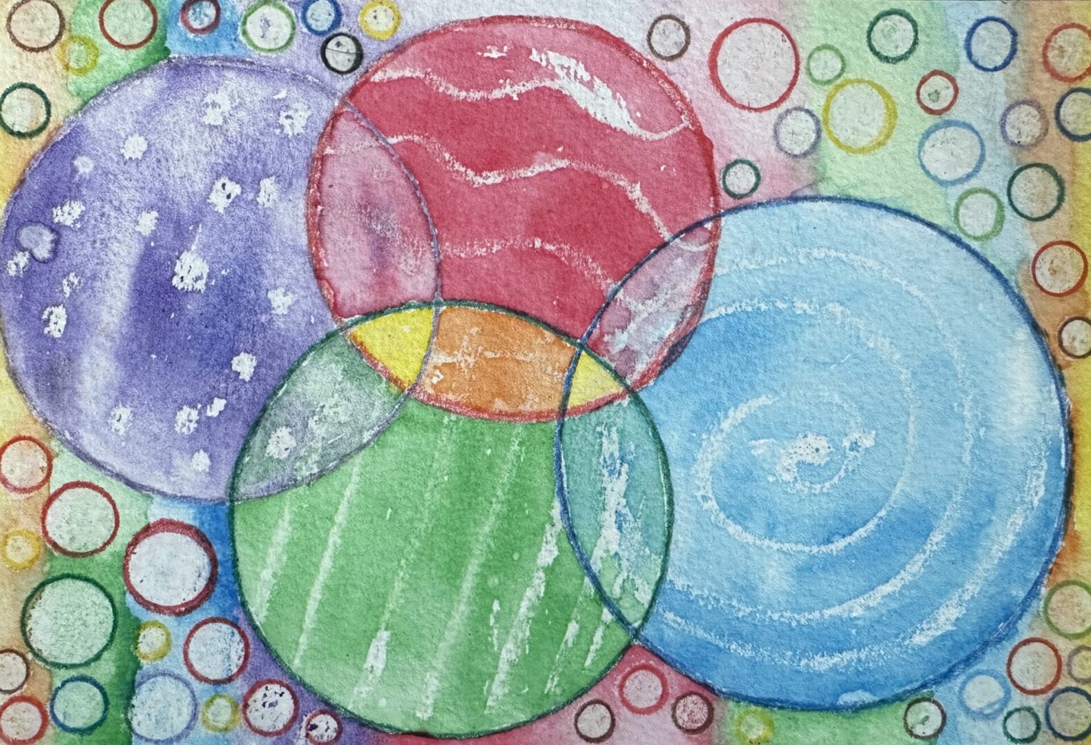 A painting of colorful circles and bubbles on paper.